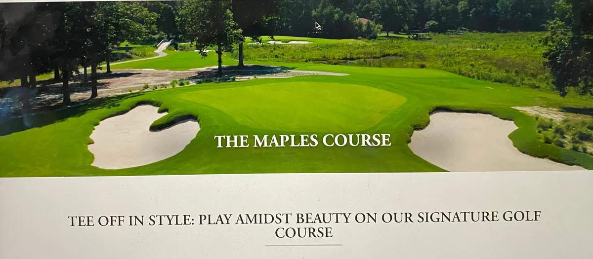 A panoramic view of the Woodlake Country Club golf course, with lush green fairways, sand bunkers, surrounding mature trees, and tranquil water features. Golfers are seen enjoying a round while others relax or socialize along the course, all set against a serene, inviting backdrop.